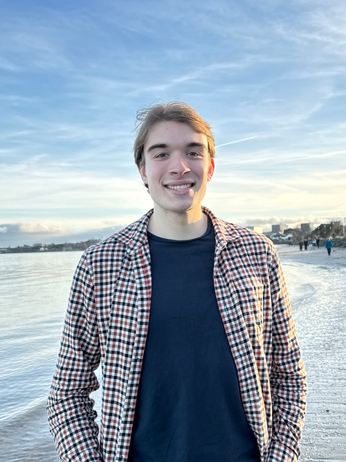 Me standing on a beach in Ireland during sunset