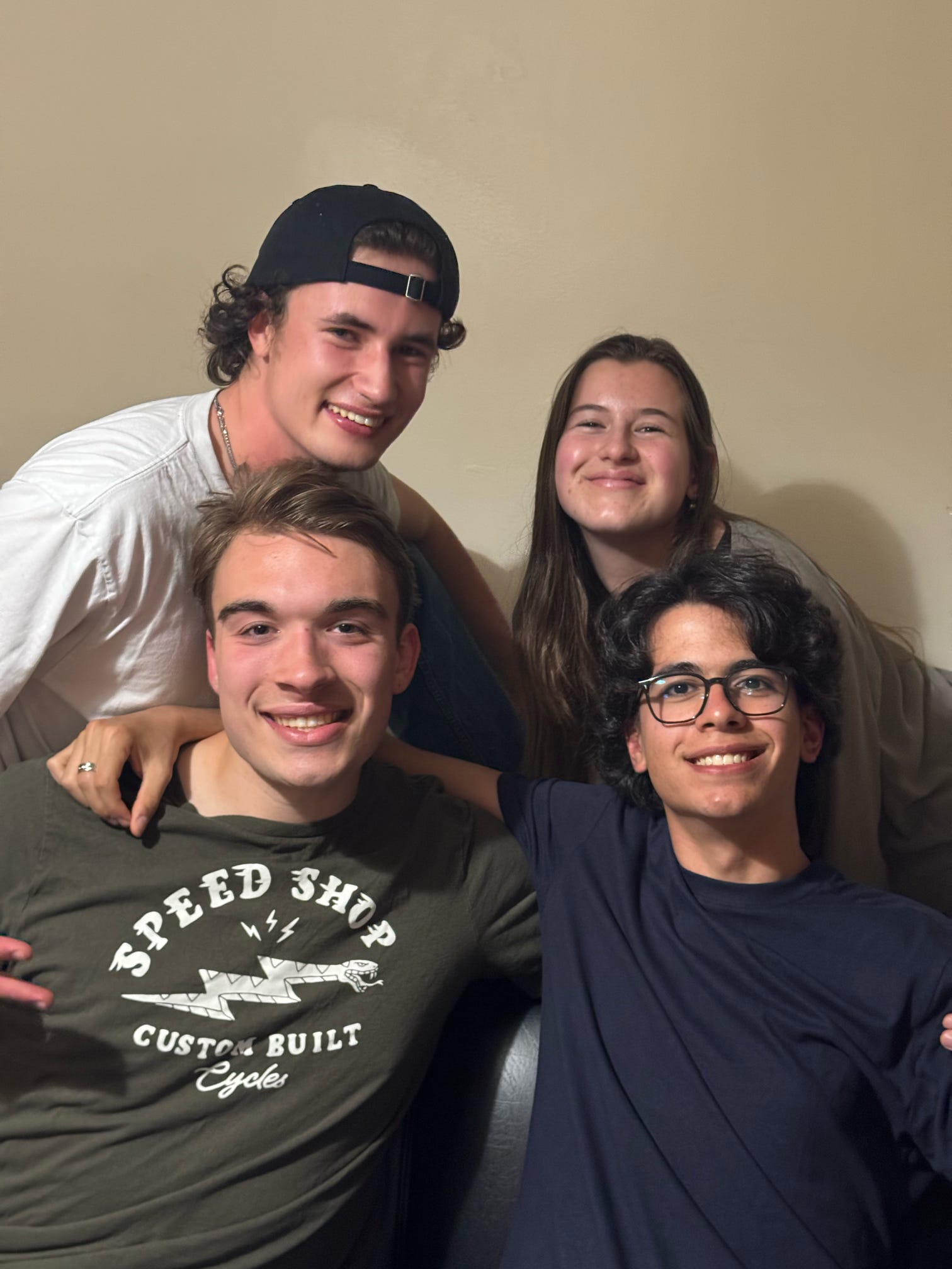 Us huddling together on the couch, starting top left Mo, Lisanne, Me, Vittorio