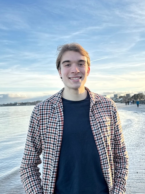 Me standing on a beach in Ireland during sunset