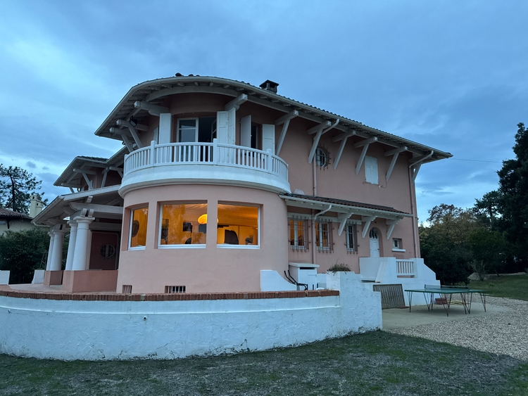 The sid eof the house with a large column coming out