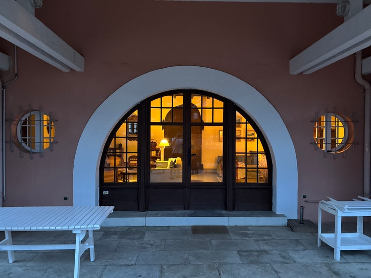 The semicircular back entrance with round windows on the sides