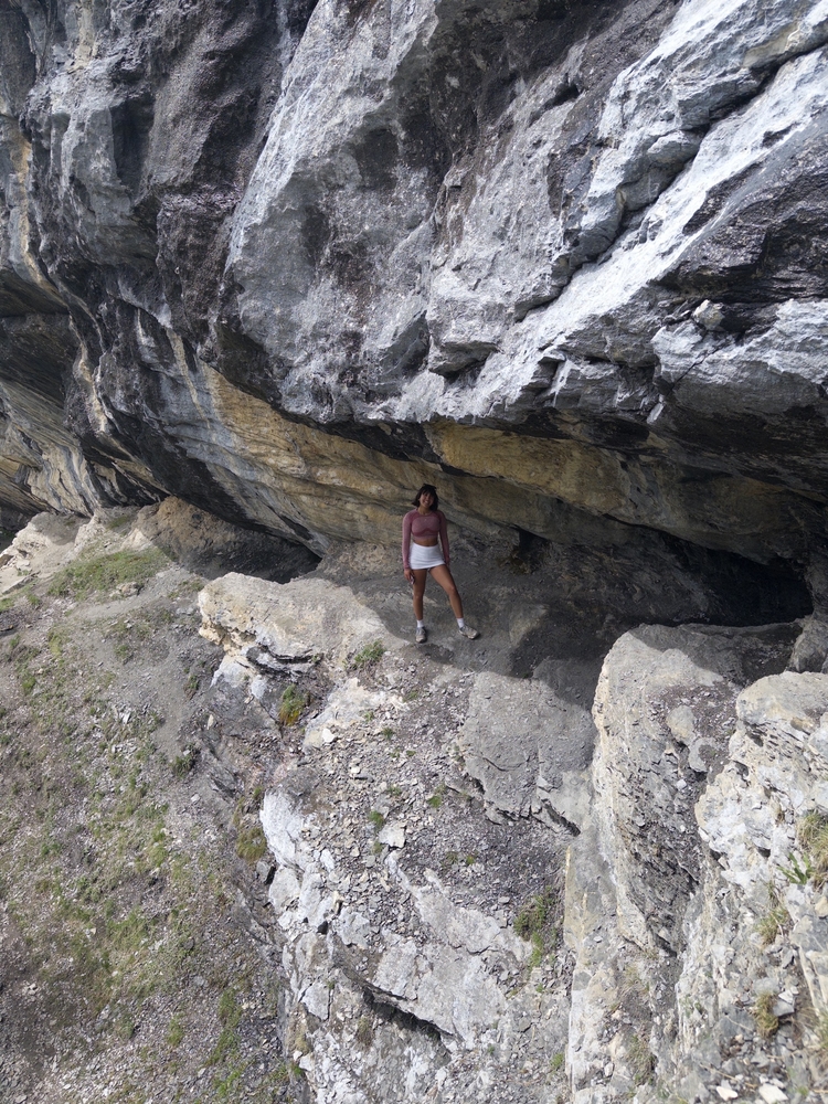 Nadia standing in a rock crevice