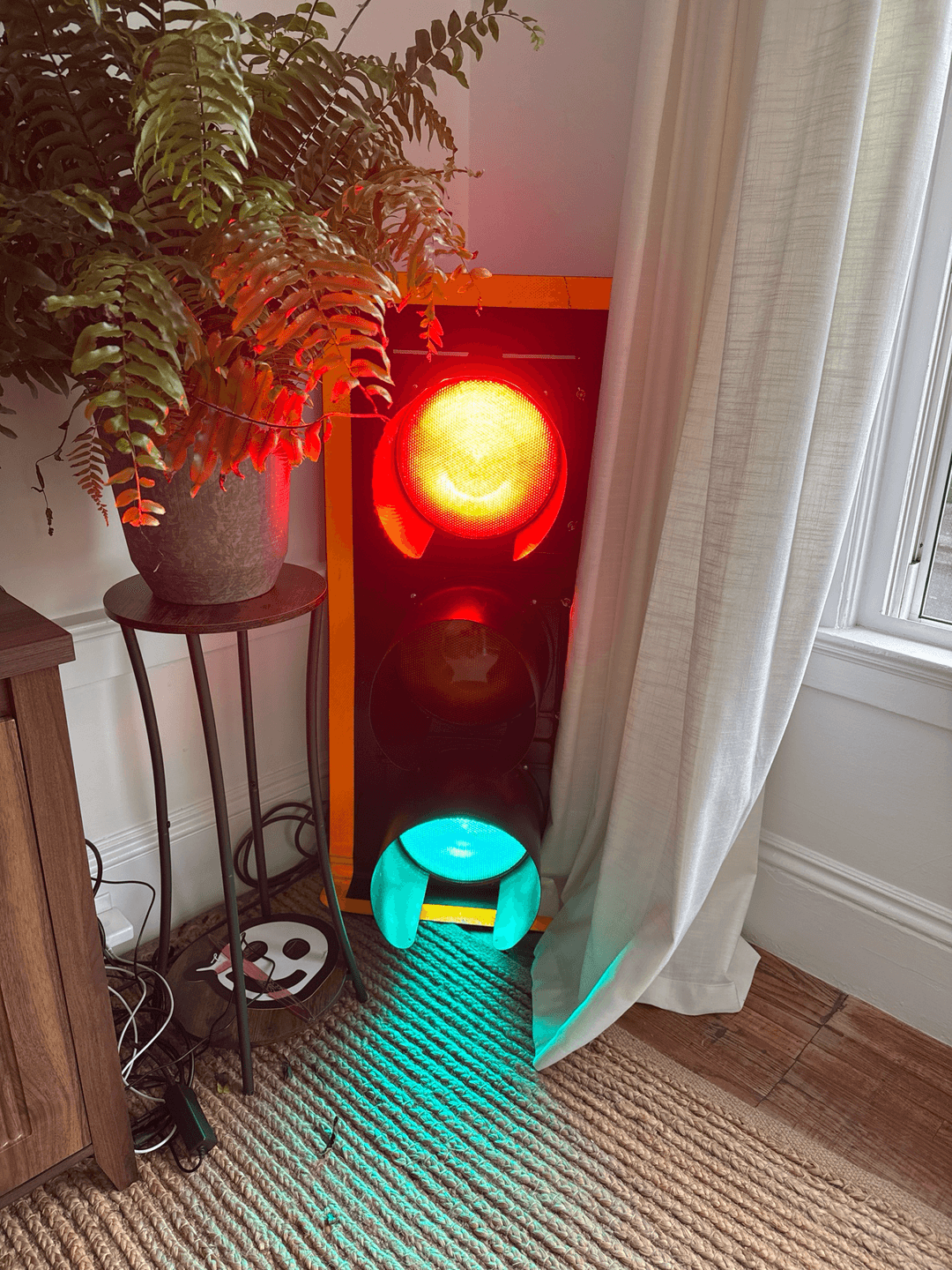 A traffic light with both its red and green lights on.