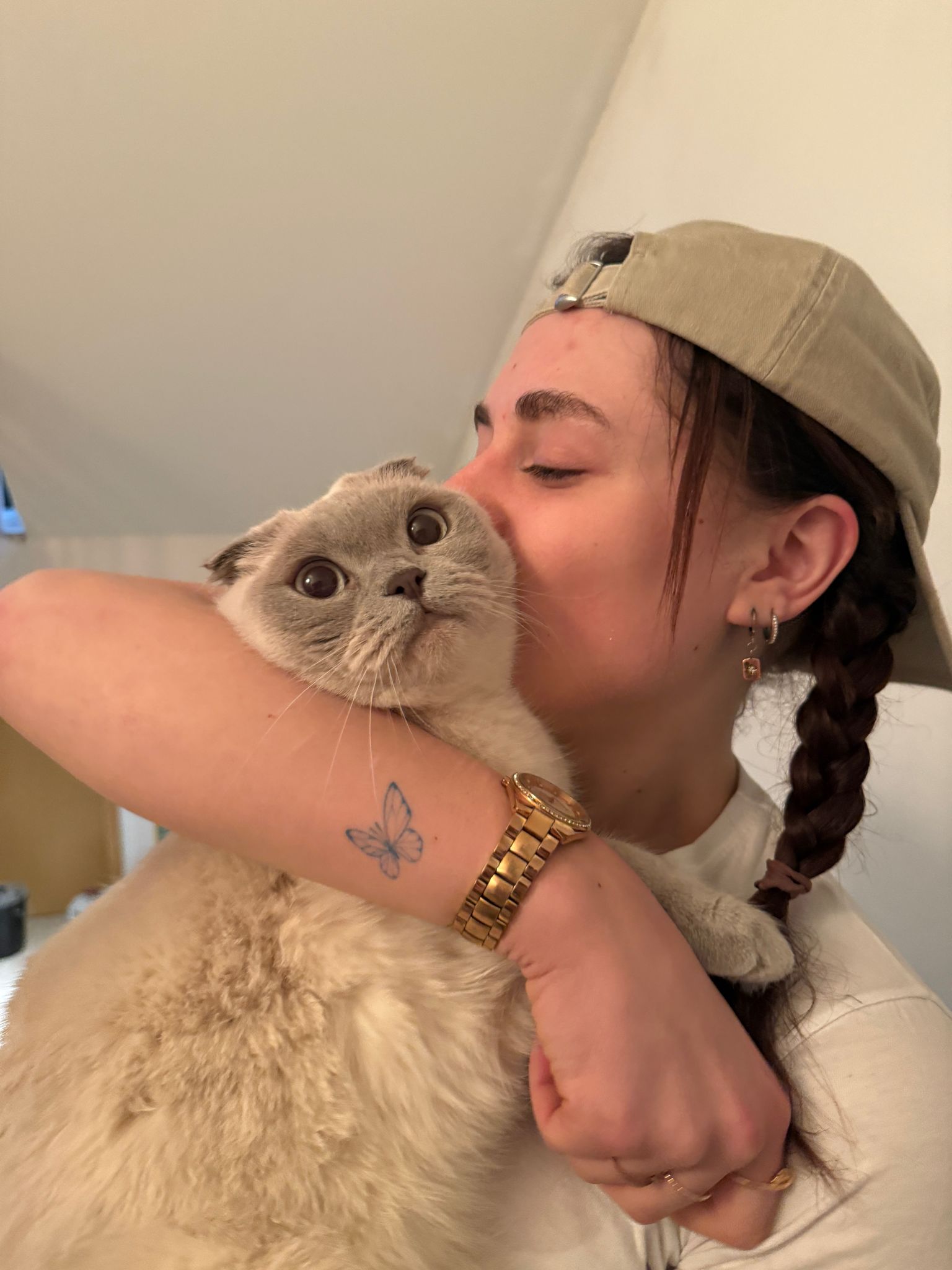 Christina kissing one of her cats