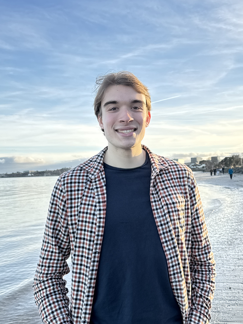 Me standing on a beach in Ireland during sunset